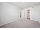 Spacious bedroom with neutral carpet and access to an en-suite bathroom and walk-in closet at 19079 E 94Th Pl, Commerce City, CO 80022