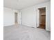 Bedroom with carpet, walk-in closet, and natural light at 19079 E 94Th Pl, Commerce City, CO 80022
