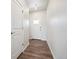 Hallway with hardwood floors leading to the front door at 19079 E 94Th Pl, Commerce City, CO 80022