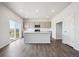 Well-lit kitchen with stainless appliances and light gray cabinetry at 19079 E 94Th Pl, Commerce City, CO 80022