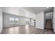 Spacious living room showcasing an open floor plan, hardwood floors, and abundant natural light at 19079 E 94Th Pl, Commerce City, CO 80022