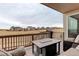 Outdoor deck area with comfortable seating, fire pit and neighborhood views at 23049 E Narrowleaf Dr, Aurora, CO 80016