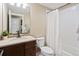 Bathroom featuring modern vanity, fixtures, a shower with subway tiles, and ample lighting at 1079 Parkline Ln, Monument, CO 80132