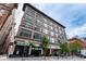 Street-level view of a multi-story building with storefronts and a well-maintained facade at 720 16Th St # 207, Denver, CO 80202