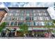 Building exterior features large windows, street-level retail, and architectural details at 720 16Th St # 207, Denver, CO 80202
