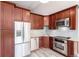 The renovated kitchen features stainless steel appliances, granite countertops and wooden cabinets at 720 16Th St # 207, Denver, CO 80202