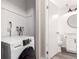 Convenient laundry room with modern washer and dryer hookups, next to the bathroom at 720 16Th St # 207, Denver, CO 80202