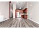 Spacious living area with updated kitchen, light gray flooring, and plenty of natural light at 720 16Th St # 207, Denver, CO 80202