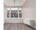 Bright living room featuring large windows and modern track lighting fixture at 720 16Th St # 207, Denver, CO 80202