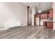 Spacious living area with updated kitchen, light gray flooring, and plenty of natural light at 720 16Th St # 207, Denver, CO 80202