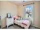 Bright bedroom with white furniture, plush pillows and carpet at 13638 Garfield St # C, Thornton, CO 80602