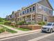 Attractive townhomes featuring stone accents, covered entryways, and well-maintained landscaping enhance curb appeal at 13638 Garfield St # C, Thornton, CO 80602