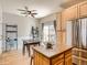 Bright eat-in kitchen with stainless steel appliances and access to the patio at 13638 Garfield St # C, Thornton, CO 80602