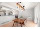 Inviting dining area featuring a stylish light fixture and easy access to the adjacent kitchen at 6650 Stagecoach Ave, Firestone, CO 80504