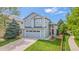 Inviting two-story house featuring a well-kept lawn, two-car garage and appealing architectural details at 6650 Stagecoach Ave, Firestone, CO 80504