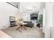 Bright living room featuring high ceilings, neutral carpet, and ample space for comfortable seating at 6650 Stagecoach Ave, Firestone, CO 80504