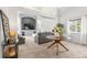 Spacious living room with a large window, plush carpeting and comfortable seating, perfect for relaxing at 6650 Stagecoach Ave, Firestone, CO 80504