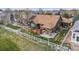 Aerial view of the backyard with a deck, patio, and fenced yard, providing privacy and outdoor space at 2190 Coyote Creek Dr, Fort Lupton, CO 80621
