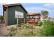 Backyard view featuring a wooden deck and a fenced yard, perfect for outdoor relaxation and entertainment at 2190 Coyote Creek Dr, Fort Lupton, CO 80621