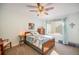 Comfortable bedroom with ceiling fan and natural light at 2190 Coyote Creek Dr, Fort Lupton, CO 80621