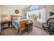 Bright bedroom with a large window, offering natural light and a view of the neighborhood at 2190 Coyote Creek Dr, Fort Lupton, CO 80621