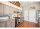 Well-equipped kitchen featuring stainless steel appliances and sleek countertops at 2190 Coyote Creek Dr, Fort Lupton, CO 80621