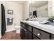 Bathroom with stylish vanity, framed mirror, and shower-tub combo at 5300 E Cherry Creek South Dr # 324, Denver, CO 80246