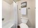 Bright bathroom features a tub with white tiling and a decorative shower curtain at 5300 E Cherry Creek South Dr # 324, Denver, CO 80246