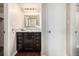 Nicely appointed bathroom with elegant mirror and wood vanity at 5300 E Cherry Creek South Dr # 324, Denver, CO 80246