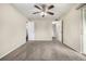 Neutral bedroom with ceiling fan, carpet floors, and access to a bathroom at 5300 E Cherry Creek South Dr # 324, Denver, CO 80246
