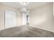 Spacious bedroom with carpet flooring, a closet, and neutral paint at 5300 E Cherry Creek South Dr # 324, Denver, CO 80246