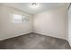 Bedroom with neutral walls, plush carpeting, a window and minimalist style at 5300 E Cherry Creek South Dr # 324, Denver, CO 80246