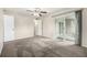 Bright bedroom with carpet flooring and sliding glass door to outdoor balcony at 5300 E Cherry Creek South Dr # 324, Denver, CO 80246