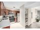 Well-lit kitchen featuring stainless steel appliances and stylish dark wood cabinetry at 5300 E Cherry Creek South Dr # 324, Denver, CO 80246