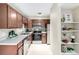 Well-lit kitchen features stainless steel appliances, spacious countertops, and sleek cabinetry at 5300 E Cherry Creek South Dr # 324, Denver, CO 80246