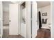 Washer and Dryer set in closet next to bathroom with wood floors at 5300 E Cherry Creek South Dr # 324, Denver, CO 80246
