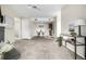 Open living space with modern lighting, neutral carpet, and plenty of room for dining at 5300 E Cherry Creek South Dr # 324, Denver, CO 80246