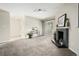 Inviting living room with neutral walls, a fireplace, and sliding glass doors to a balcony at 5300 E Cherry Creek South Dr # 324, Denver, CO 80246