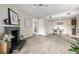 Spacious living room with an elegant fireplace, carpeting, and access to dining area at 5300 E Cherry Creek South Dr # 324, Denver, CO 80246