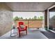 Relaxing patio featuring a red chair, side table, and privacy screen at 5300 E Cherry Creek South Dr # 324, Denver, CO 80246