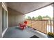 Comfortable patio featuring a privacy screen, side table, and red chair at 5300 E Cherry Creek South Dr # 324, Denver, CO 80246