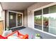 Welcoming patio with red chair, side table, privacy screen and access to sliding glass doors at 5300 E Cherry Creek South Dr # 324, Denver, CO 80246
