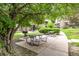 Enjoy outdoor meals at the community picnic area with grills and tables, surrounded by trees at 5300 E Cherry Creek South Dr # 324, Denver, CO 80246