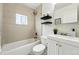 Bright bathroom featuring modern tile and fixtures at 475 S Eliot St, Denver, CO 80219