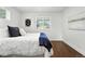 Bright bedroom with white walls, hardwood floors and large windows at 475 S Eliot St, Denver, CO 80219