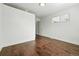Well-lit bedroom showcasing gleaming hardwood floors and closet access at 475 S Eliot St, Denver, CO 80219