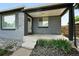 Inviting front porch featuring a well-lit entrance, tasteful landscaping, and a neatly maintained facade at 475 S Eliot St, Denver, CO 80219