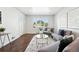 Bright and airy living room with modern decor and an open floor plan, great for entertaining at 475 S Eliot St, Denver, CO 80219
