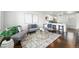 Bright and airy living room with modern decor and an open floor plan, great for entertaining at 475 S Eliot St, Denver, CO 80219