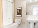 Bathroom with a toilet, pedestal sink, and shower-tub combination at 1440 Little Raven St # 107, Denver, CO 80202